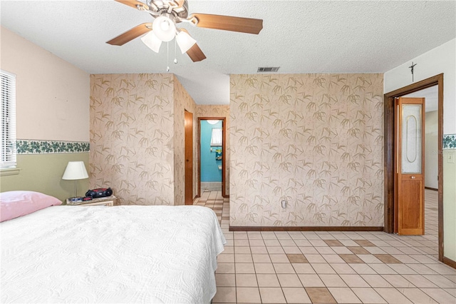 bedroom featuring a textured ceiling and ceiling fan