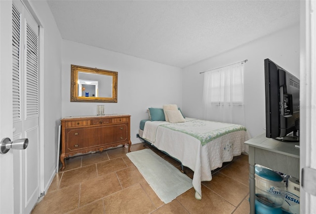 bedroom featuring a textured ceiling