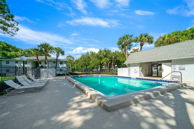 view of swimming pool featuring a patio area