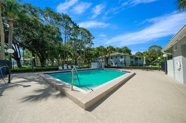 view of swimming pool featuring a patio area