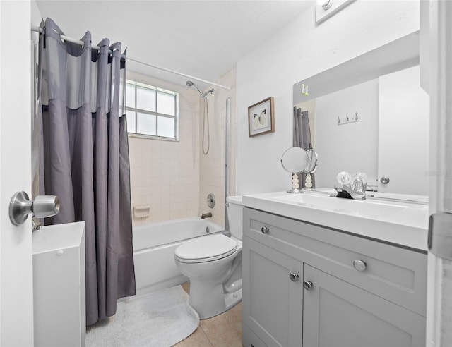 bathroom with tile patterned floors, shower / bath combo with shower curtain, toilet, and vanity