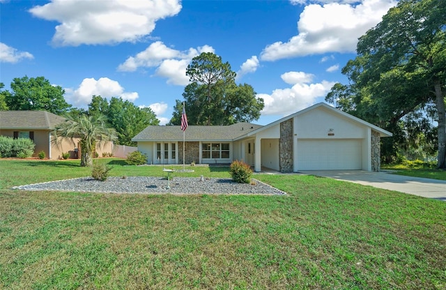 ranch-style home featuring a garage and a front yard