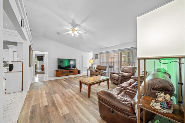 living area with lofted ceiling, light wood-style flooring, visible vents, and ceiling fan