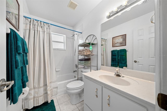 bathroom featuring shower / bath combination with curtain, visible vents, toilet, vanity, and tile patterned floors