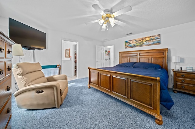 carpeted bedroom with visible vents, ceiling fan, and a textured ceiling