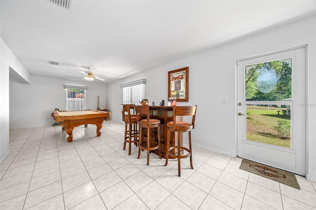 game room with light tile patterned floors, pool table, a dry bar, and visible vents