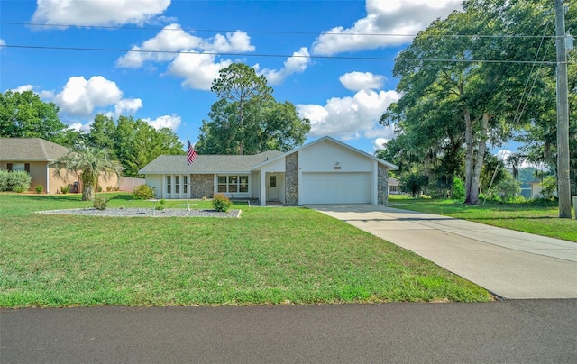 ranch-style home featuring a front yard, stone siding, driveway, and an attached garage