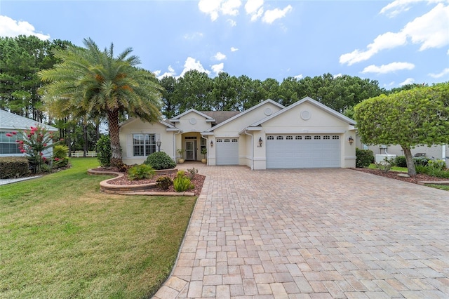 ranch-style house with a garage and a front lawn