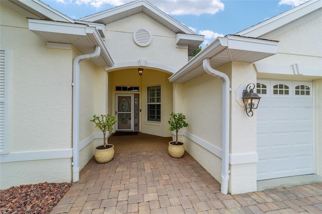 property entrance with a garage