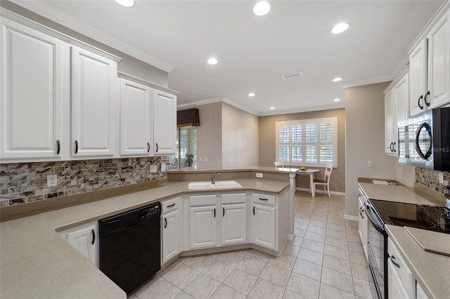 kitchen featuring backsplash, white cabinetry, and stainless steel appliances