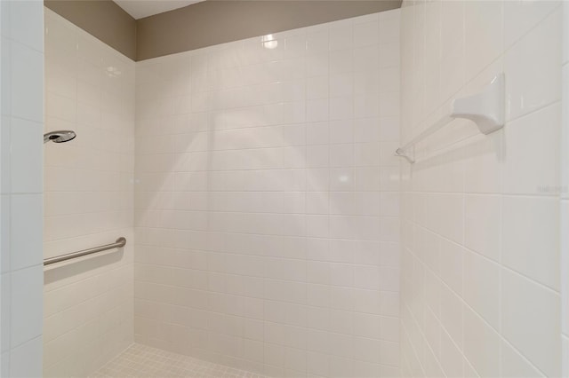 bathroom with tiled shower