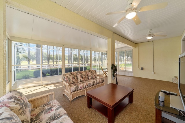 sunroom with ceiling fan and a healthy amount of sunlight