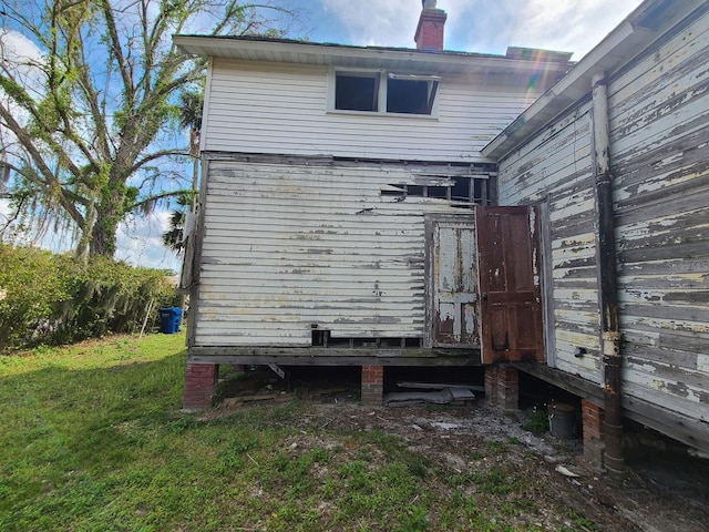 back of house with a yard