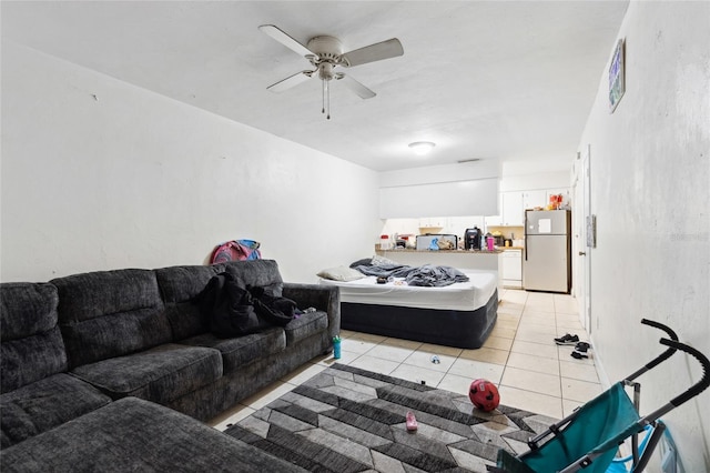 living room with ceiling fan and light tile floors