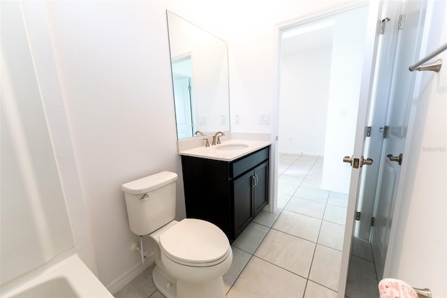 bathroom with vanity, toilet, and tile patterned flooring