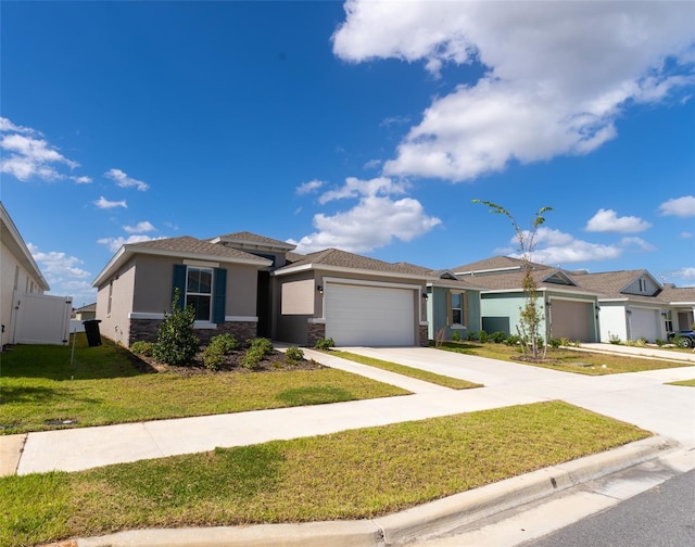 view of front of home with a front lawn and a garage