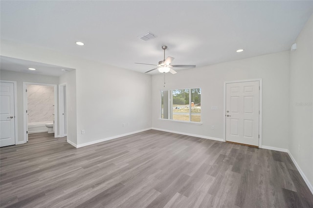 empty room featuring light wood-type flooring and ceiling fan