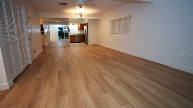 unfurnished living room with ceiling fan and light hardwood / wood-style floors