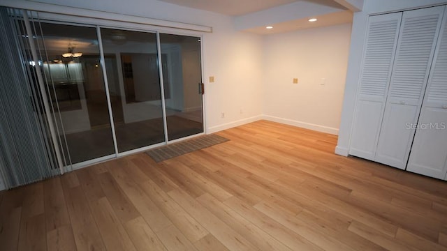 unfurnished room with light hardwood / wood-style flooring