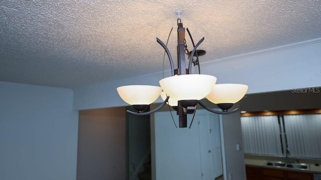 details featuring sink and a textured ceiling