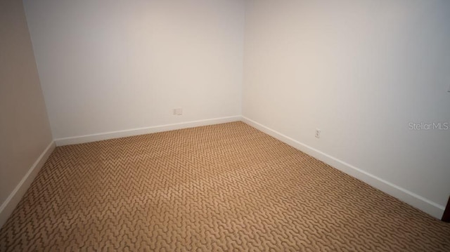 unfurnished room with carpet flooring