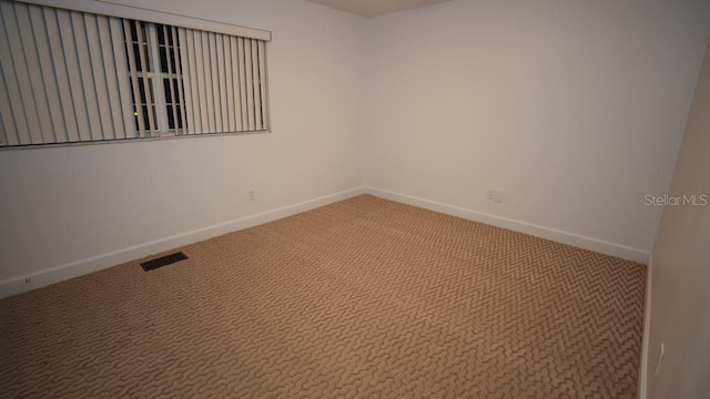 view of carpeted spare room