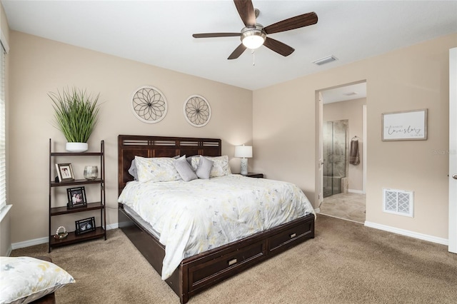 bedroom with ensuite bath, ceiling fan, and carpet