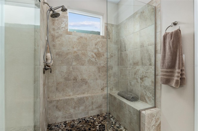 bathroom featuring tiled shower