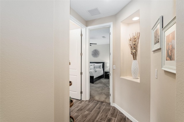 hall with dark hardwood / wood-style flooring