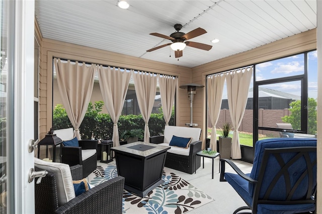 sunroom with plenty of natural light and ceiling fan