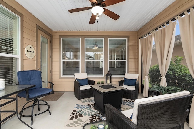 view of patio with an outdoor living space and ceiling fan