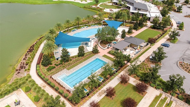 birds eye view of property with a water view