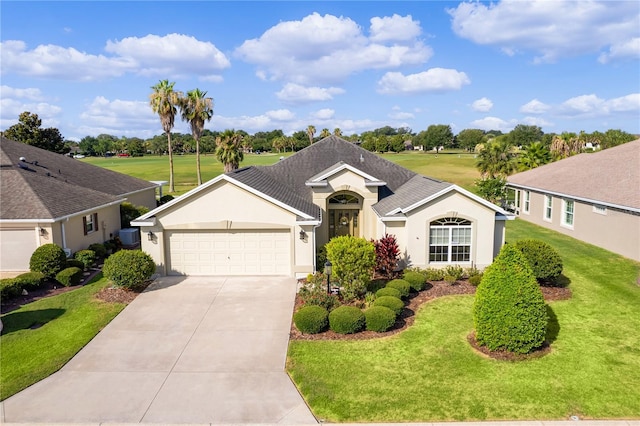 ranch-style home with a garage and a front lawn