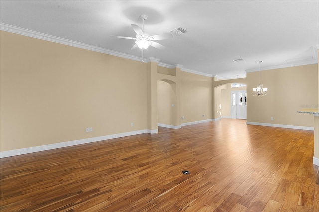 unfurnished living room with ceiling fan with notable chandelier, light hardwood / wood-style flooring, and crown molding