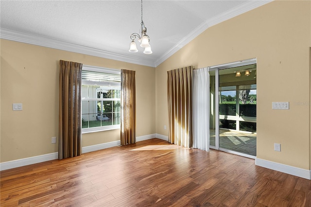 unfurnished room featuring ornamental molding, a chandelier, lofted ceiling, and wood-type flooring