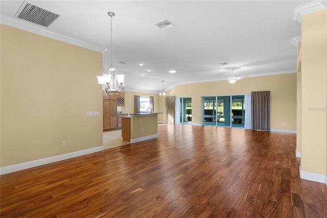 unfurnished living room featuring crown molding, wood-type flooring, and ceiling fan with notable chandelier