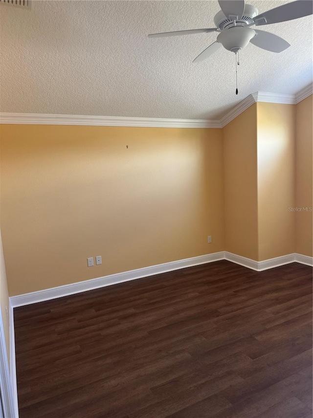 empty room featuring a textured ceiling, dark hardwood / wood-style flooring, ceiling fan, and crown molding