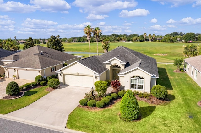 single story home featuring a front yard and a garage