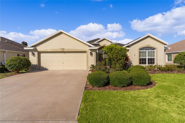 ranch-style home featuring a garage and a front lawn