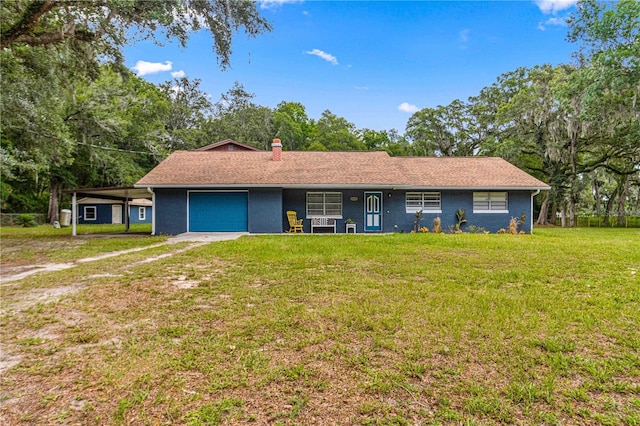 ranch-style home featuring a garage and a front yard