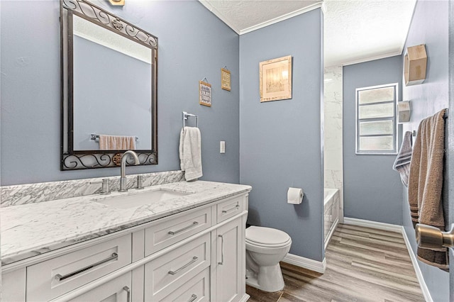 full bathroom with toilet, a textured ceiling, shower / tub combination, vanity, and hardwood / wood-style flooring