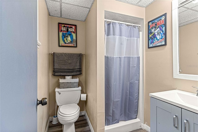 bathroom with vanity, a shower with curtain, toilet, and hardwood / wood-style flooring