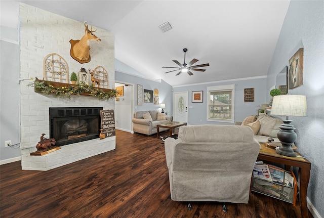 living room featuring ceiling fan, a fireplace, dark hardwood / wood-style floors, and vaulted ceiling