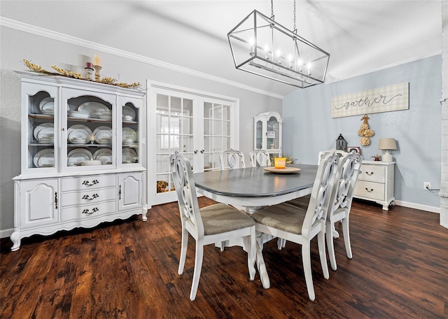 dining area featuring dark hardwood / wood-style floors and crown molding