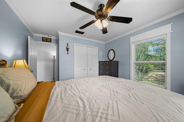 bedroom with ceiling fan and ornamental molding