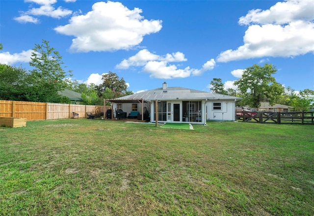 back of house with a yard