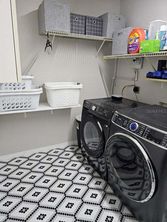 laundry room featuring washing machine and dryer