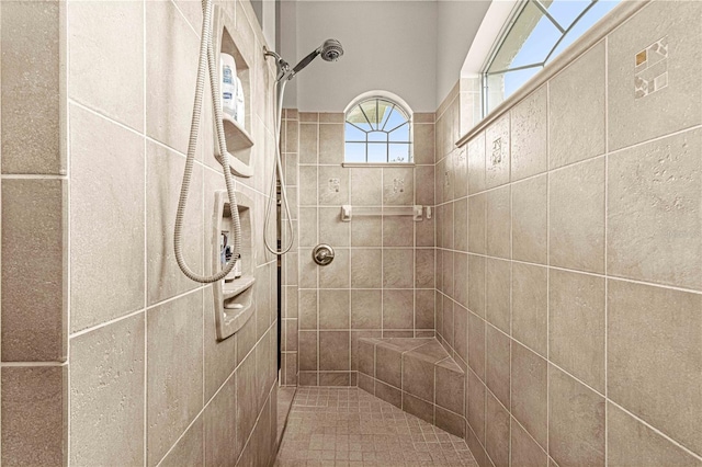 bathroom featuring tiled shower