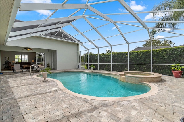 view of pool featuring an in ground hot tub, a lanai, ceiling fan, and a patio area