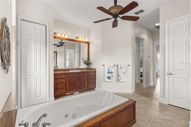 bathroom with vanity, a washtub, tile patterned flooring, and ceiling fan